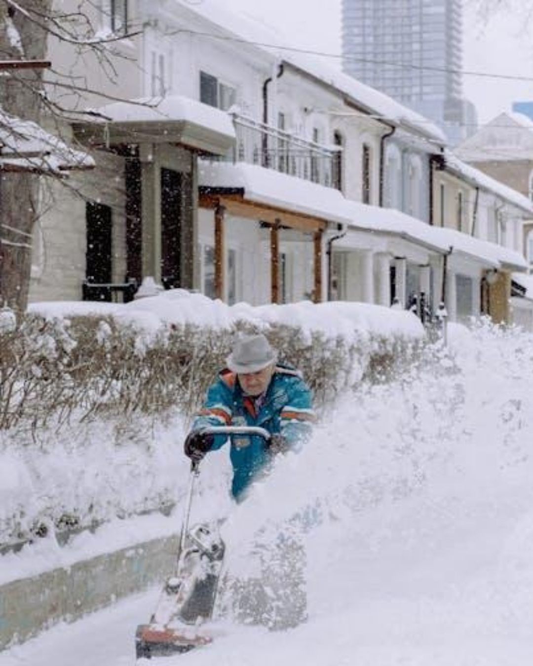 A person using a snow shovel